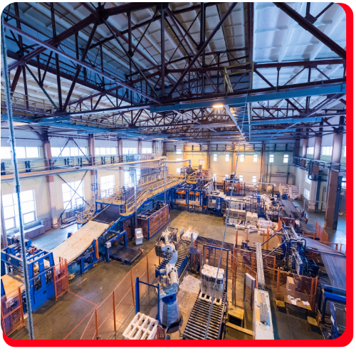 Wide view of a large industrial manufacturing facility showing equipment and workstations, representing post-accident cleanup and hazard restoration services in Toronto.