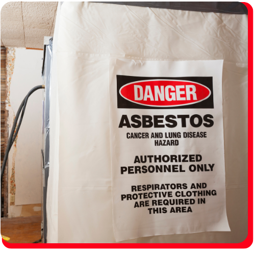 Warning sign for asbestos hazard inside a commercial building in Toronto, indicating restricted access and required protective gear during abatement.