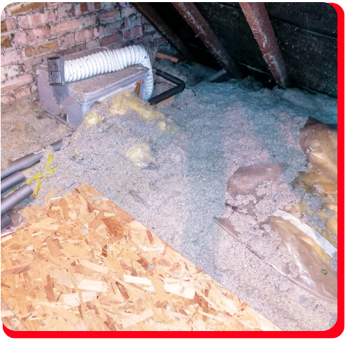 Contaminated attic space with vermiculite insulation containing asbestos, prepared for commercial asbestos removal in a Toronto building.