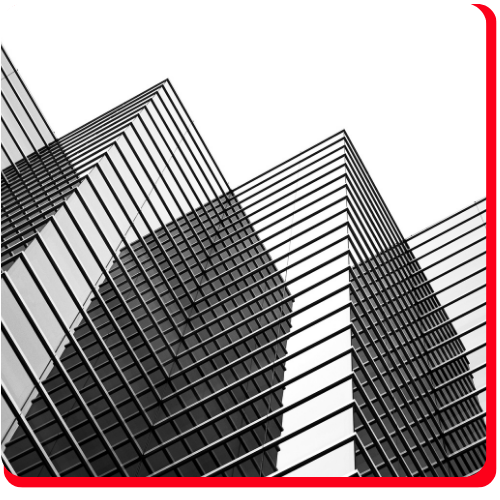A dramatic upward view of a modern glass high-rise building in Toronto, showcasing the facade and structural elements targeted in building envelope restoration projects.