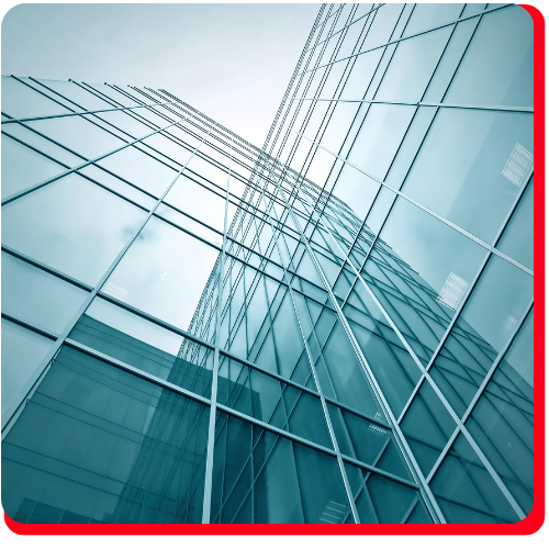 A sleek glass high-rise building in Toronto viewed from below, highlighting the exterior panels and structural glazing commonly restored in building envelope restoration projects.