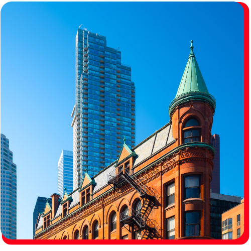 Canada, Toronto. The famous Gooderham building and the skyscrapers in the background.