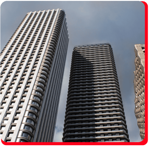 Three modern high-rise buildings with distinct window patterns rise against a cloudy sky, viewed from below. The photo features rounded corners and a red border on two sides, making it perfect for showcasing commercial restoration services such as commercial fire damage restoration or commercial water damage restoration.